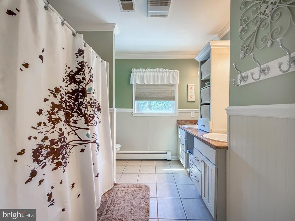 925 Big Oak Road Yardley, PA 19067 - Photo 40 of 51 a bathroom with a bathtub and shower