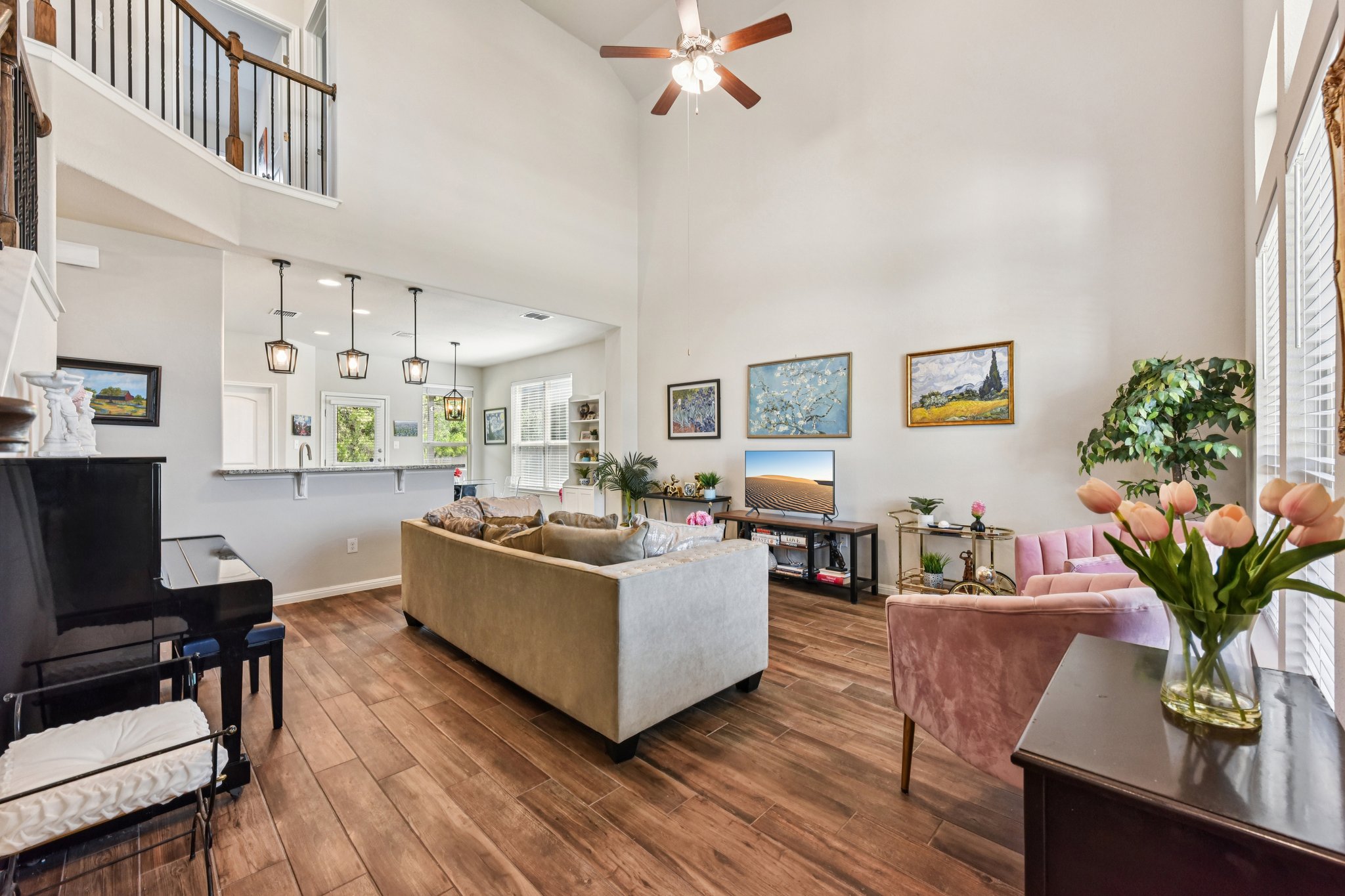 908 Goldilocks Lane Manchaca, TX 78652 - Photo 7 of 34 Featuring pristine tile floors (wood plank style), recessed lighting, & soaring vaulted ceiling in the main living area.