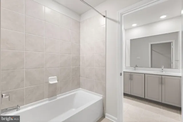 a bathroom with a bathtub and a sink