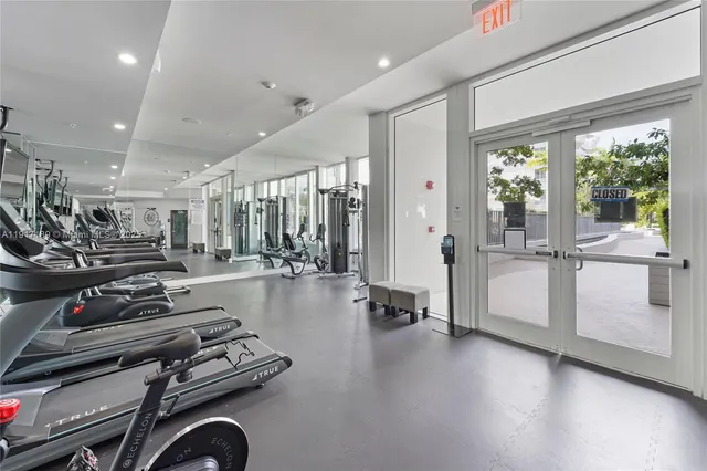 a kitchen with stainless steel appliances granite countertop a stove and a refrigerator