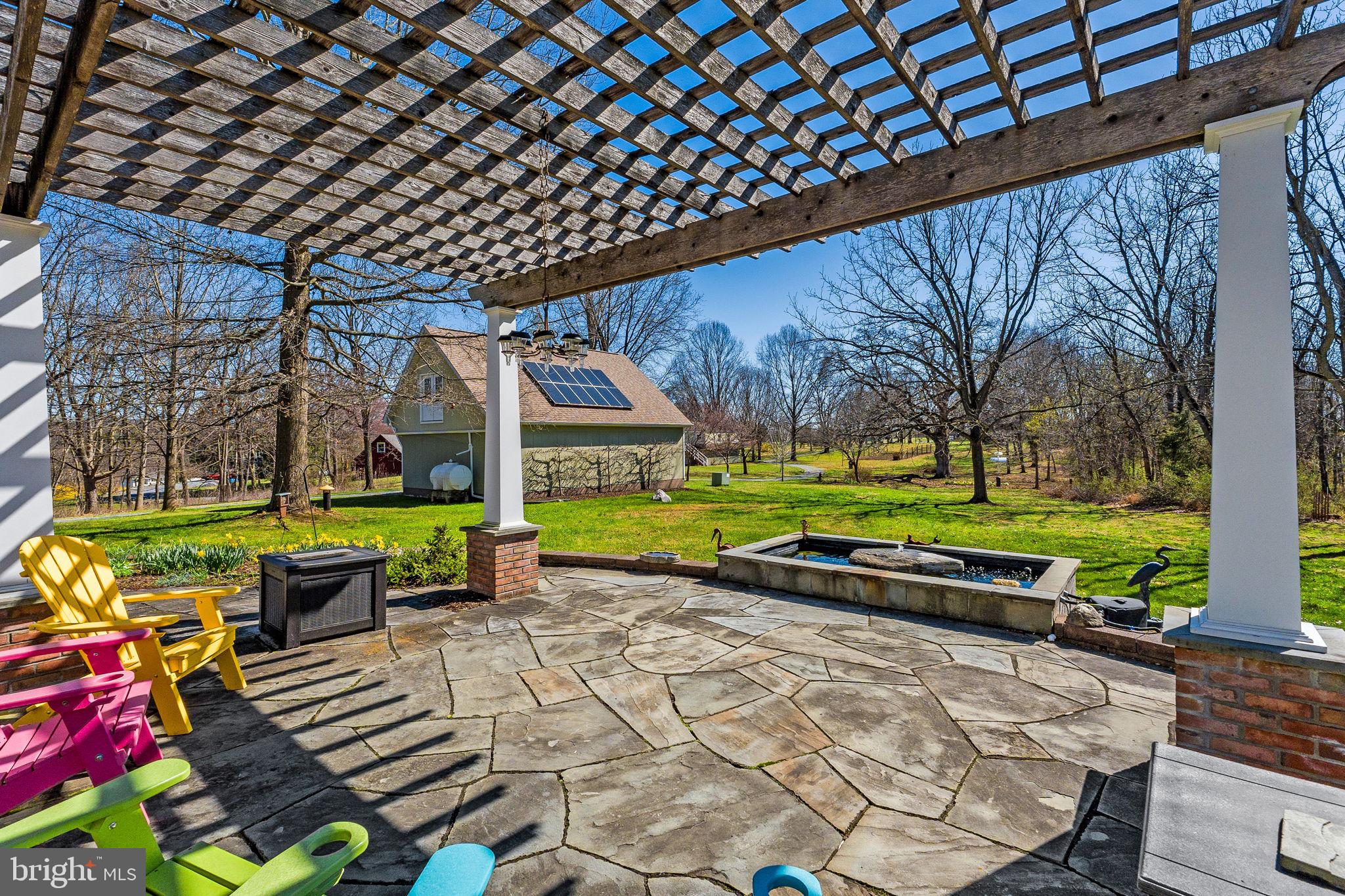 6864-6860 Engle Molers Road Shepherdstown, WV 25443 - Photo 117 of 133 Back patio with pergola, fountain, and barn/garage