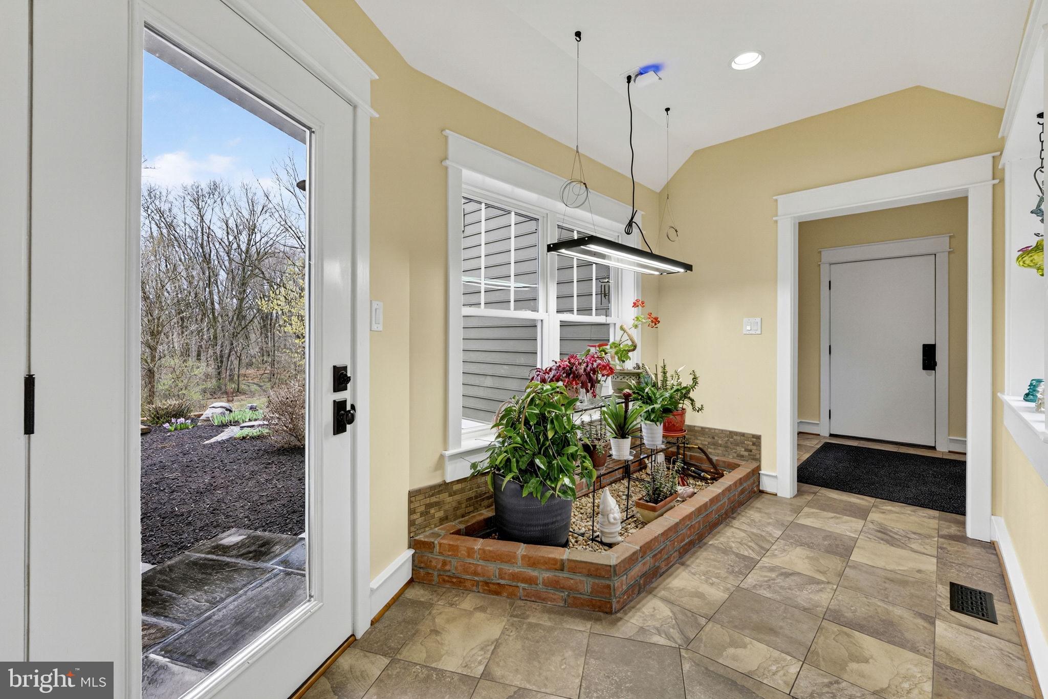 6864-6860 Engle Molers Road Shepherdstown, WV 25443 - Photo 71 of 133 First floor breezeway and garage door beyond