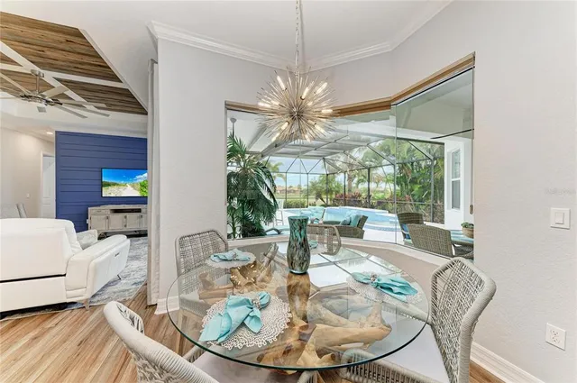 a view of a workspace with furniture and wooden floor