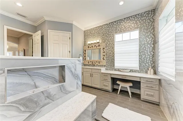 an aerial view of a house with a garden and lake view