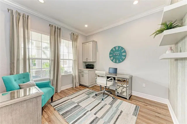 an aerial view of a house with a garden and lake view