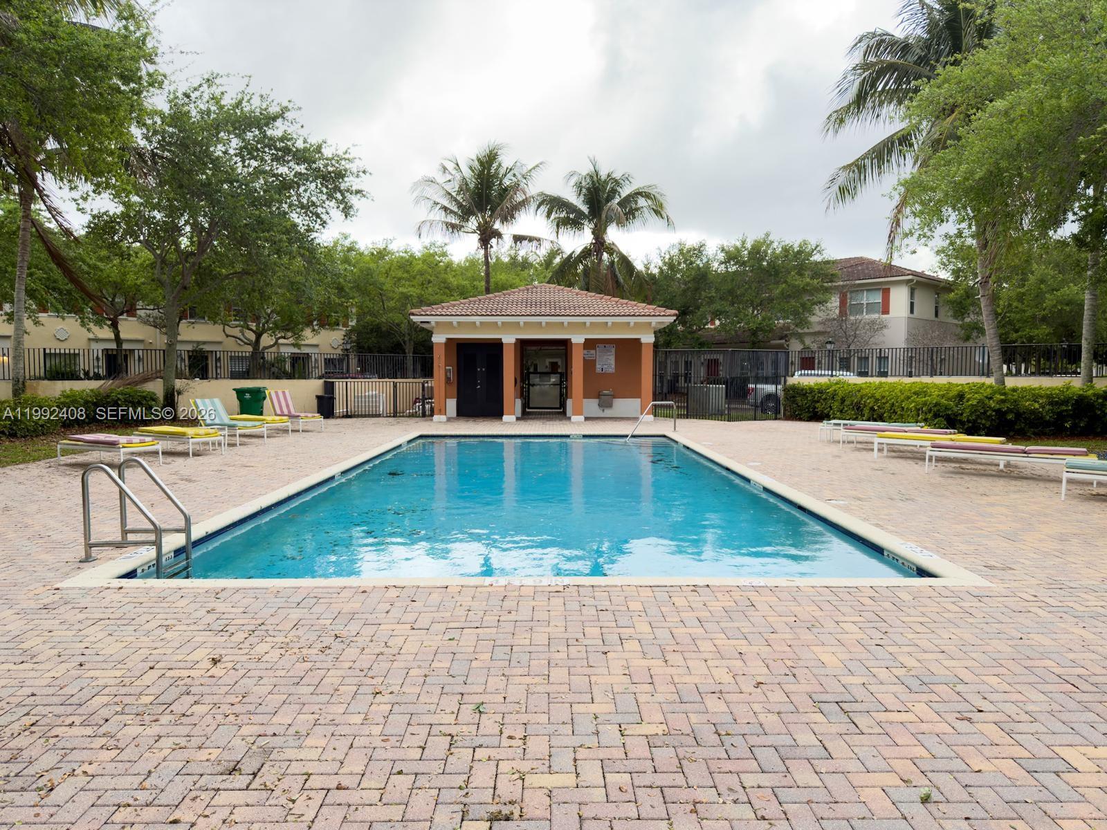 2607 Southwest 99th Way Miramar, FL 33025 - Photo 49 of 50 a view of a house with pool and sitting area