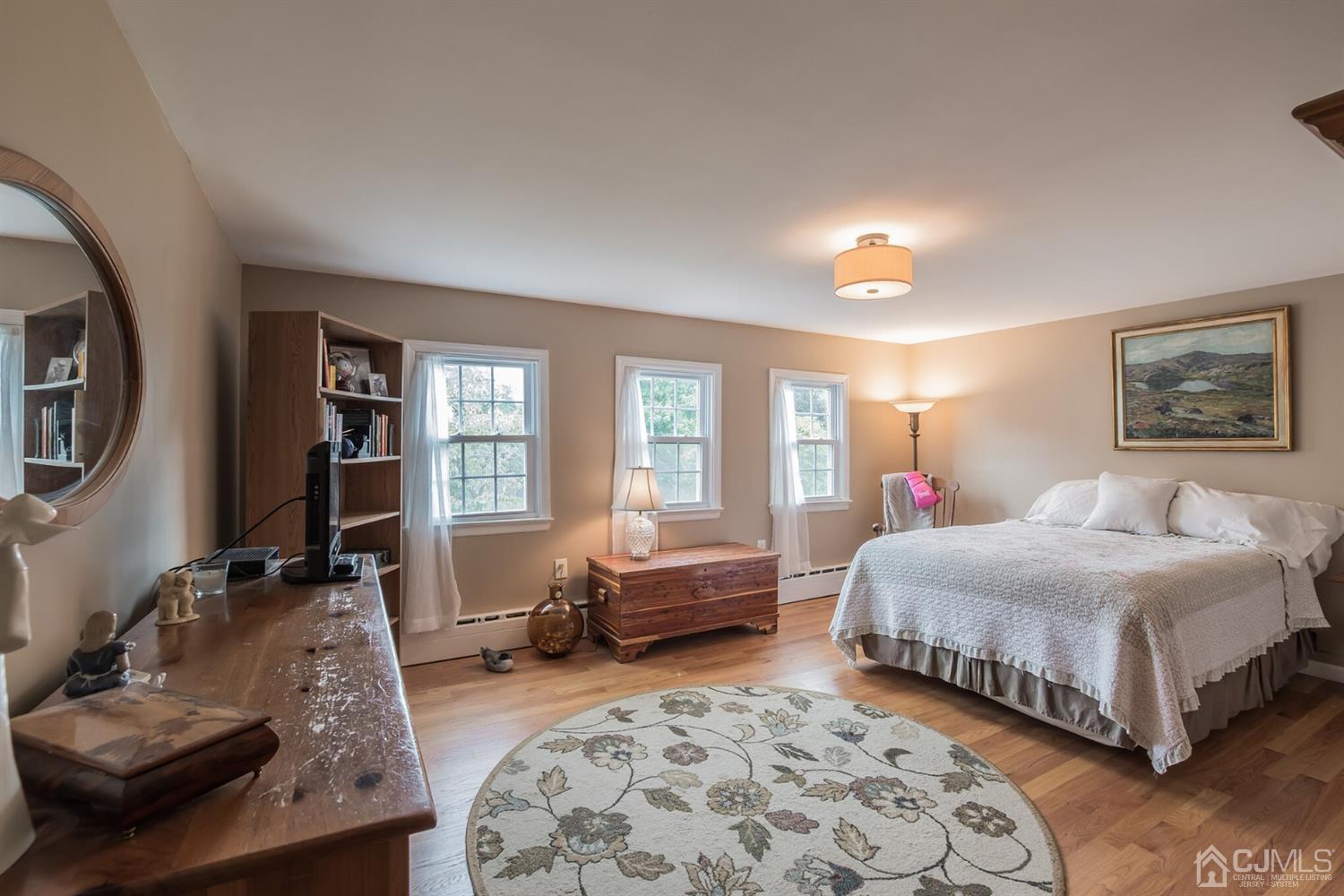 11 Station Road Cranbury, NJ 08512 - Photo 16 of 26 a bedroom with a large bed and a couch