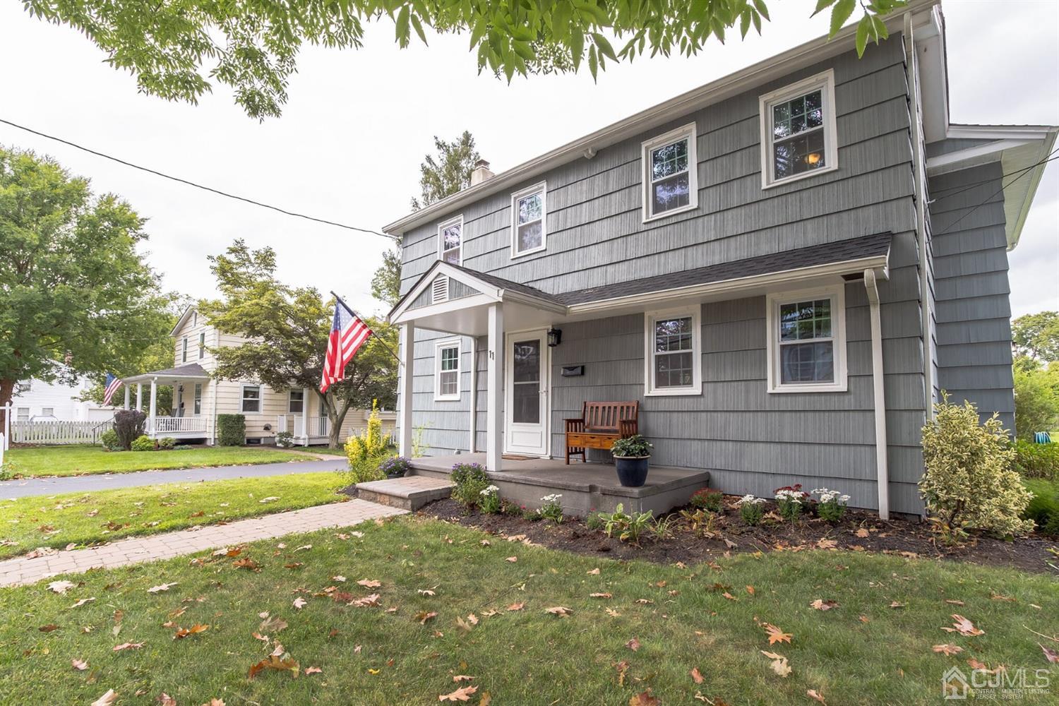 11 Station Road Cranbury, NJ 08512 - Photo 3 of 26 a front view of a house with a yard