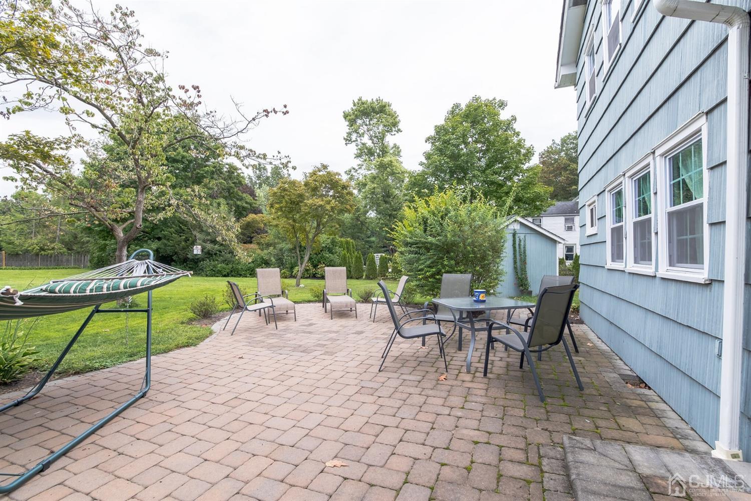 11 Station Road Cranbury, NJ 08512 - Photo 23 of 26 a view of a patio with table and chairs and potted plants