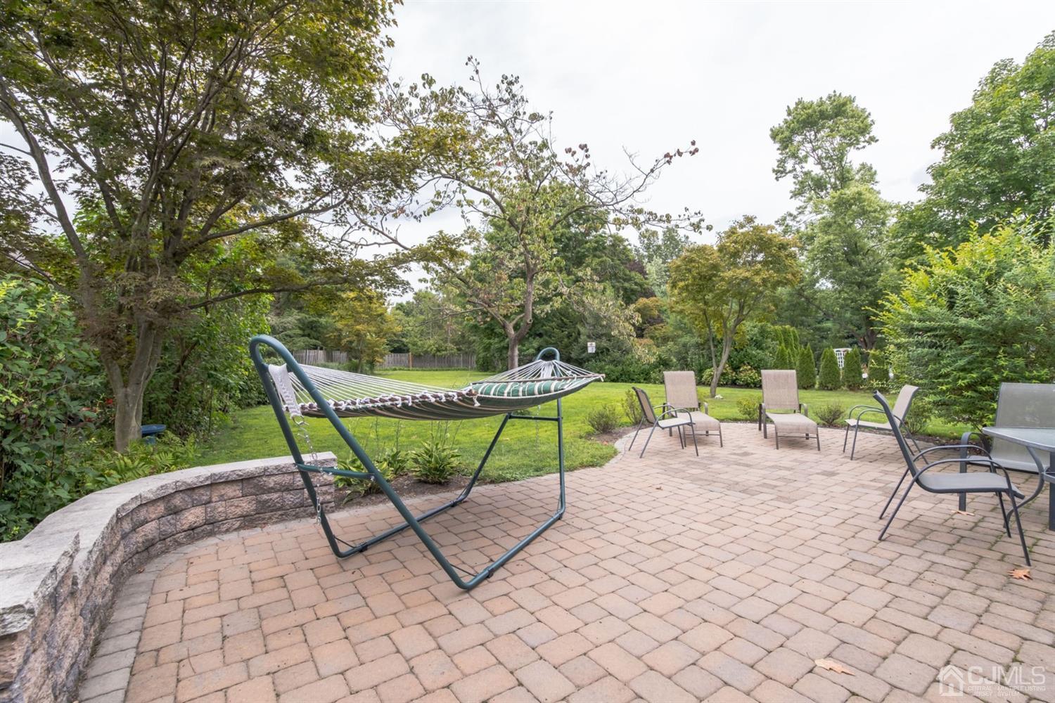 11 Station Road Cranbury, NJ 08512 - Photo 24 of 26 a view of a chairs and table in the backyard