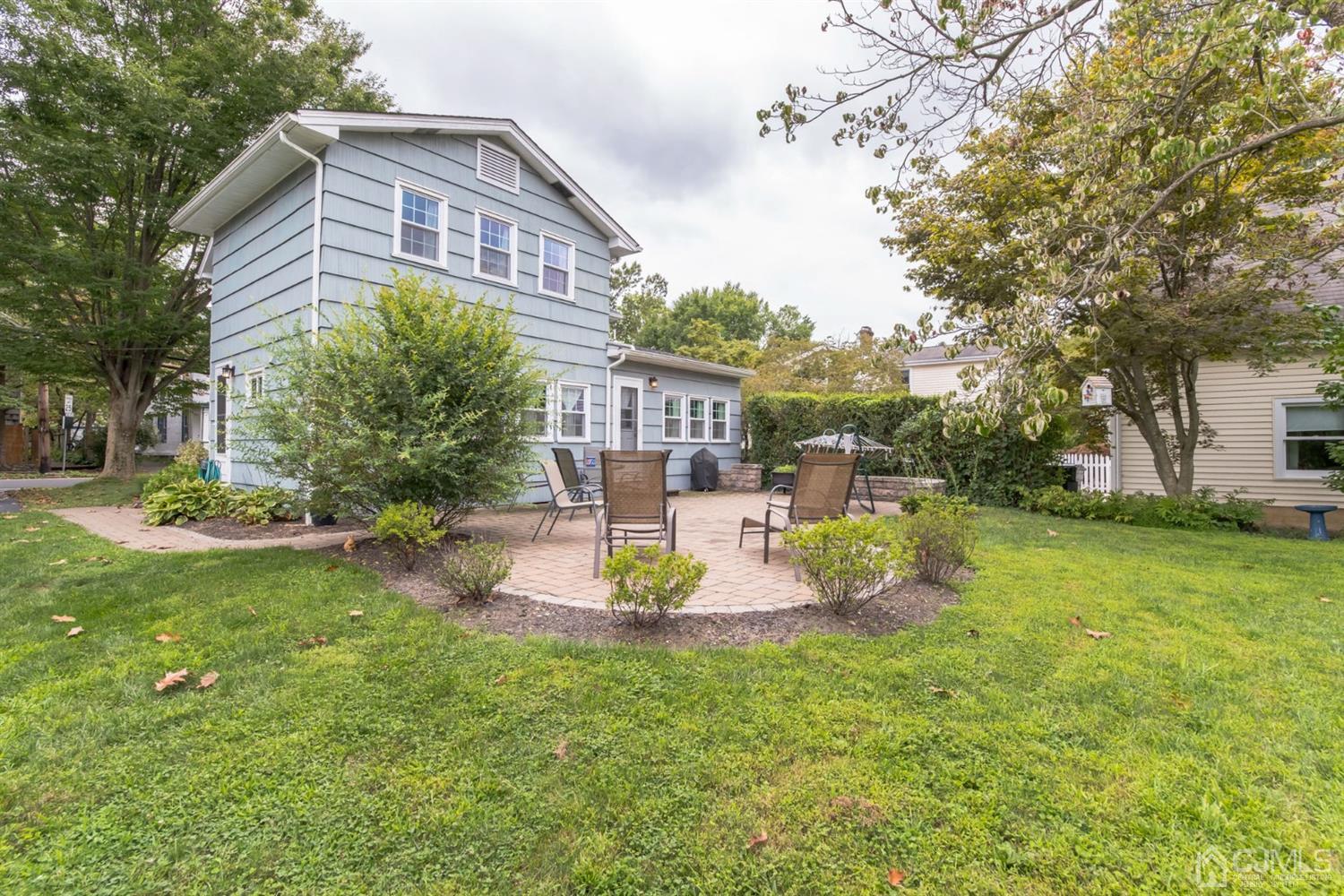 11 Station Road Cranbury, NJ 08512 - Photo 26 of 26 a front view of a house with garden and sitting area