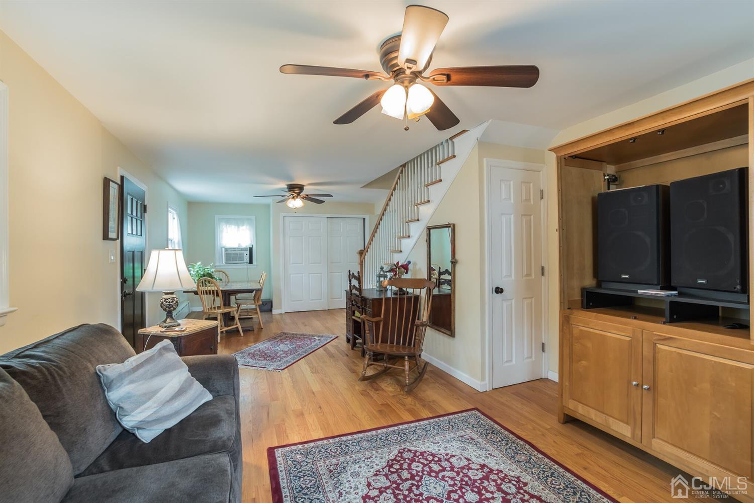 11 Station Road Cranbury, NJ 08512 - Photo 4 of 26 a living room with furniture and a flat screen tv