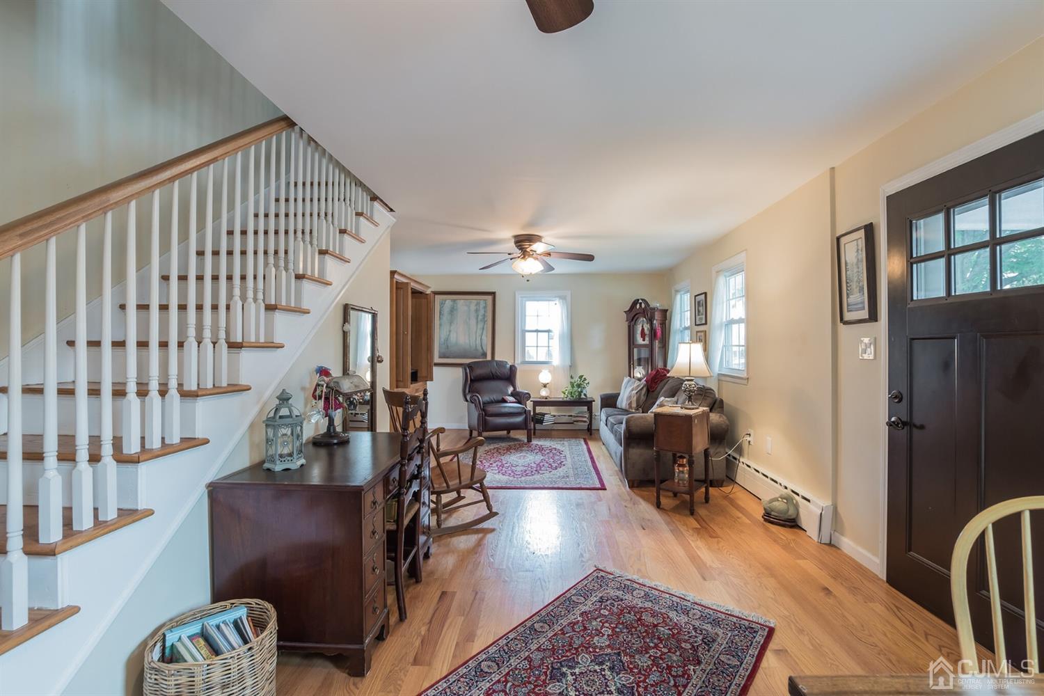 11 Station Road Cranbury, NJ 08512 - Photo 5 of 26 a living room with furniture rug and wooden floor