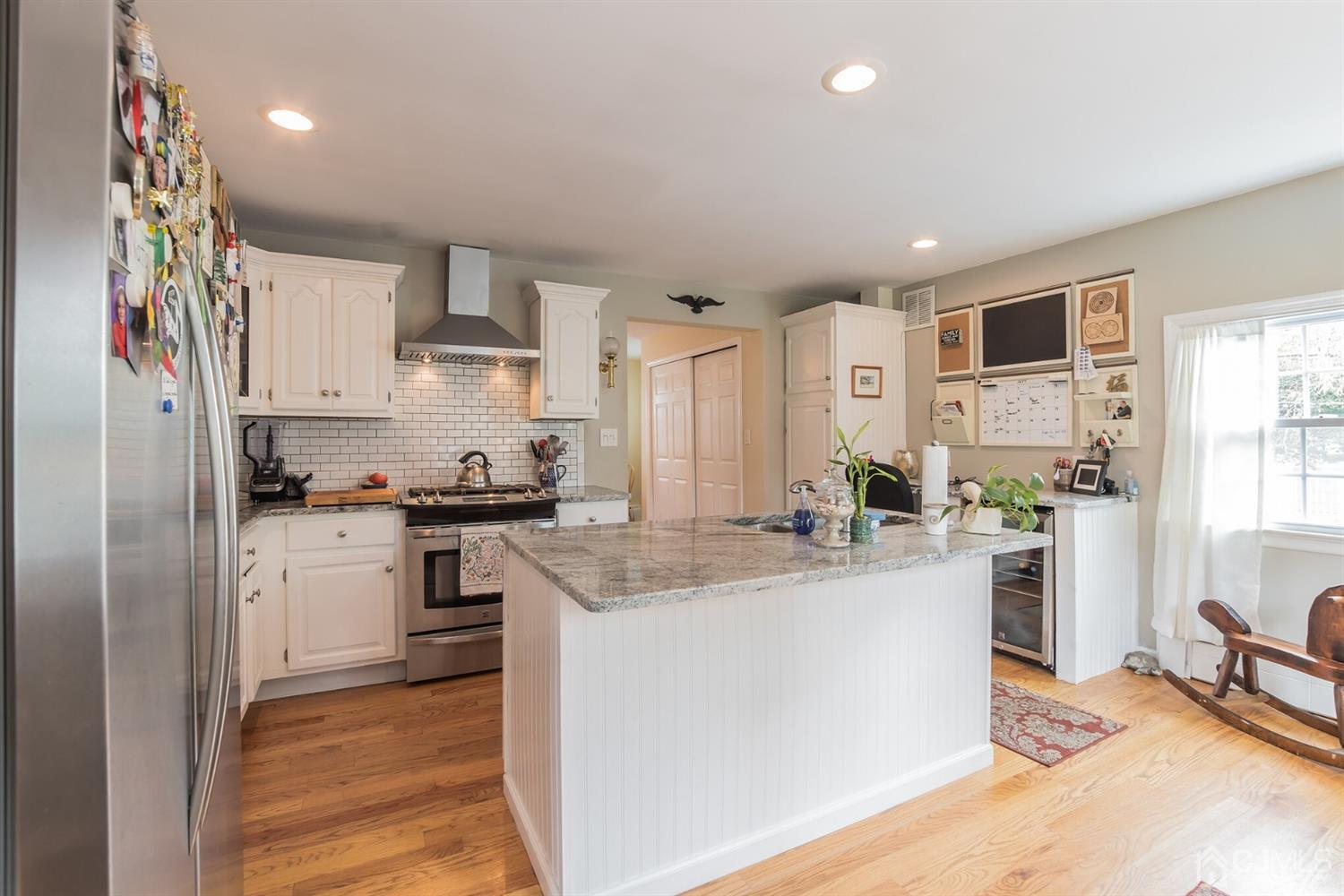 11 Station Road Cranbury, NJ 08512 - Photo 8 of 26 a kitchen that has a lot of cabinets a sink and appliances in it