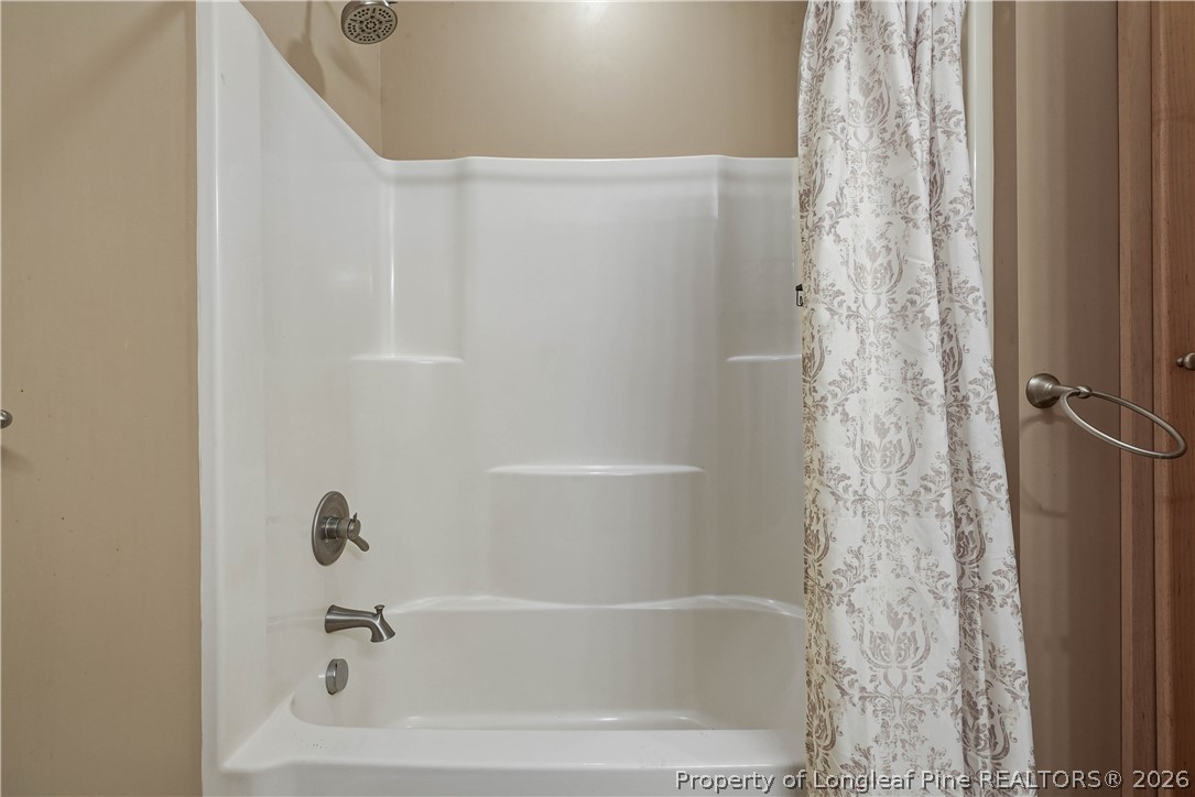 280 Hemp St Extension Robbins, NC 27325 - Photo 23 of 29 a bathroom with a bathtub