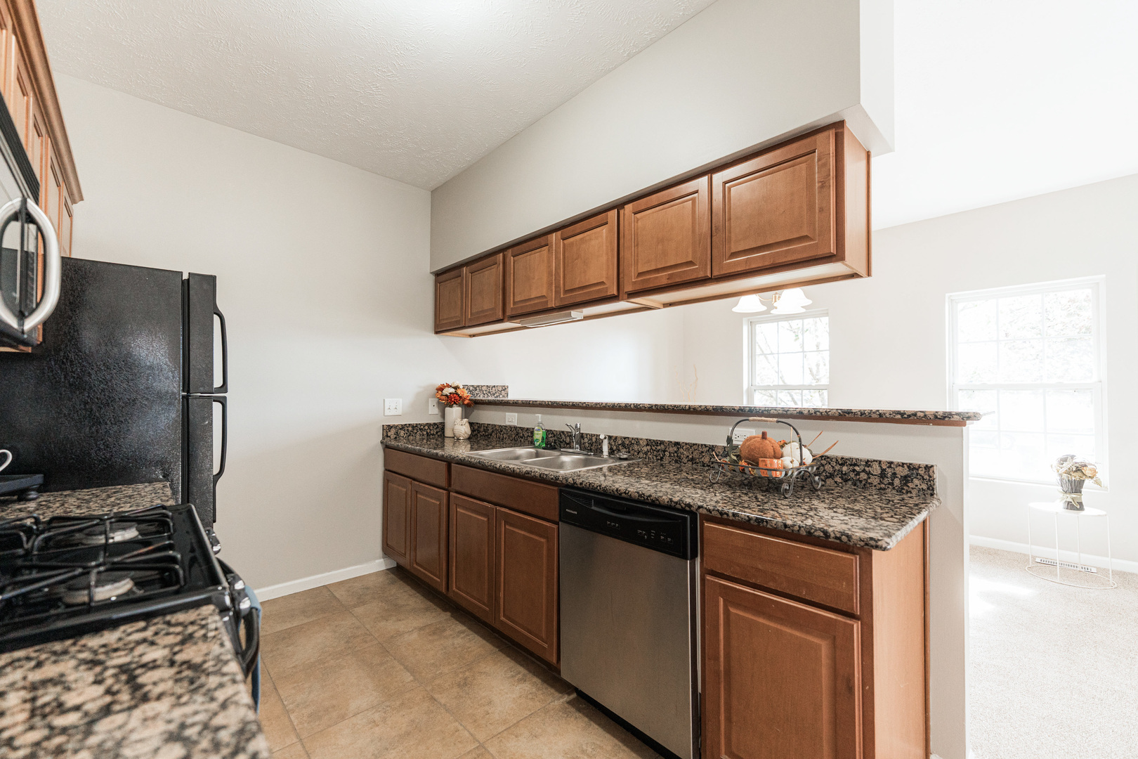 639 Stonegate Drive Sycamore, IL 60178 - Photo 13 of 32 a kitchen with stainless steel appliances granite countertop a stove and a sink