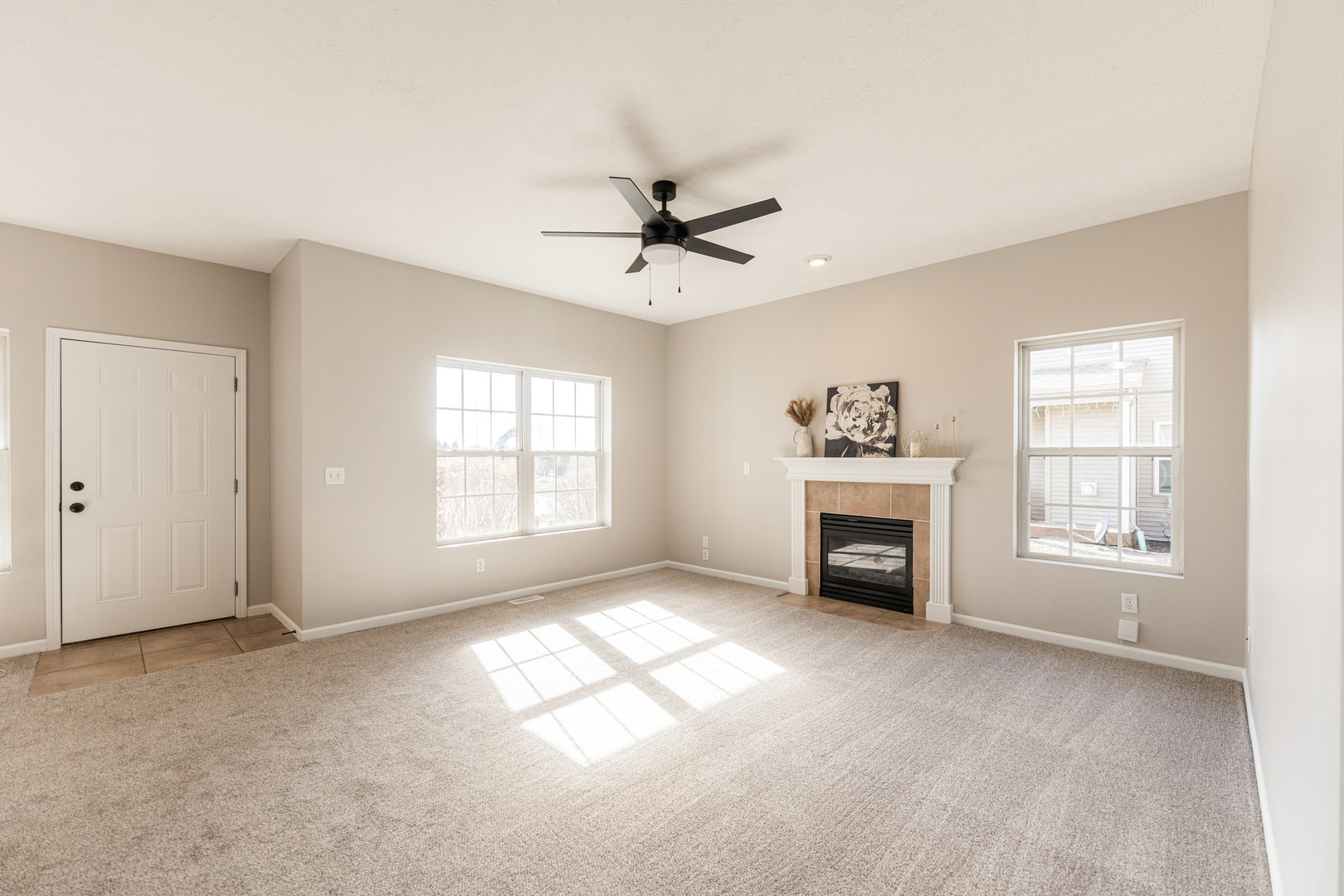 639 Stonegate Drive Sycamore, IL 60178 - Photo 10 of 32 a view of a livingroom with a fireplace and window