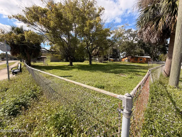 a view of a golf course with a lake view