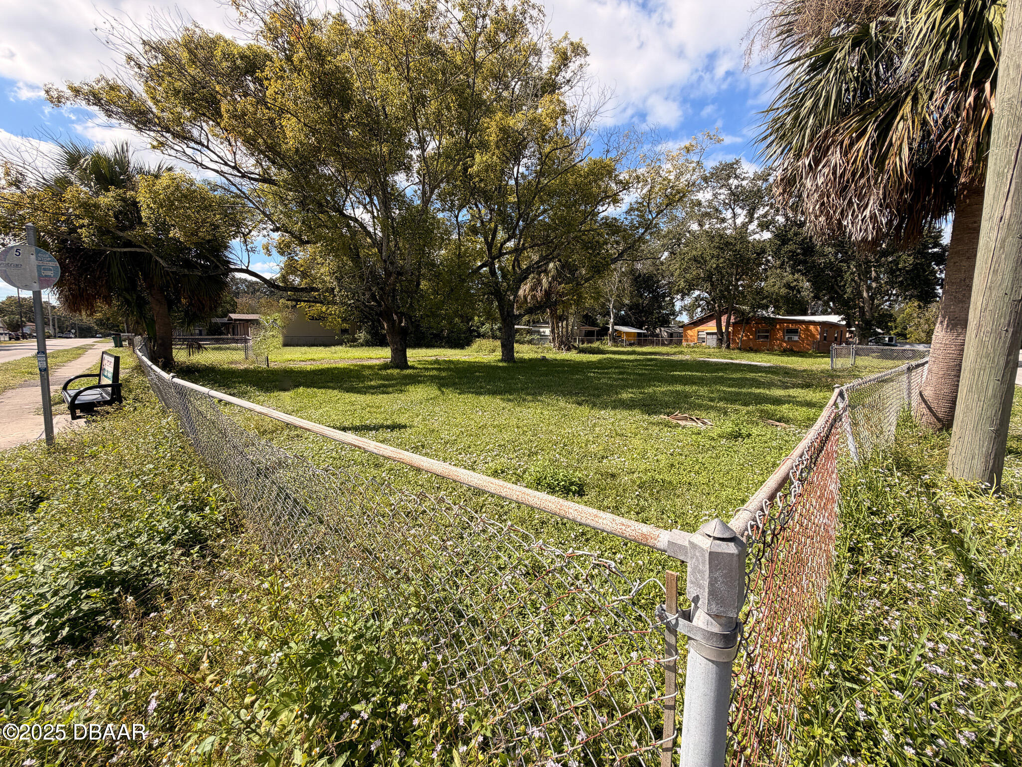 548 3rd Street Holly Hill, FL 32117 - Photo 4 of 9 a view of a golf course with a lake view