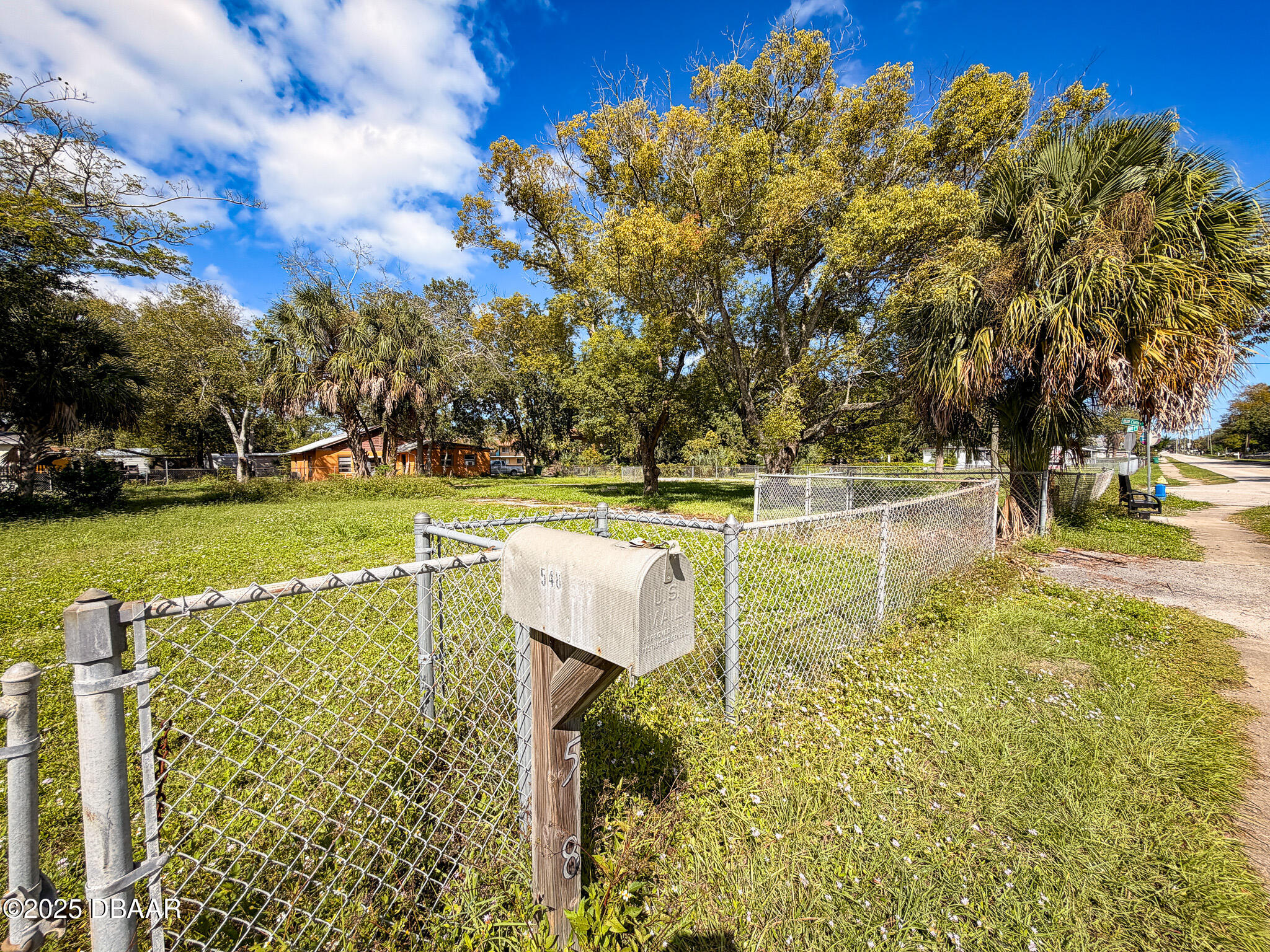 548 3rd Street Holly Hill, FL 32117 - Photo 5 of 9 a view of a lake with houses