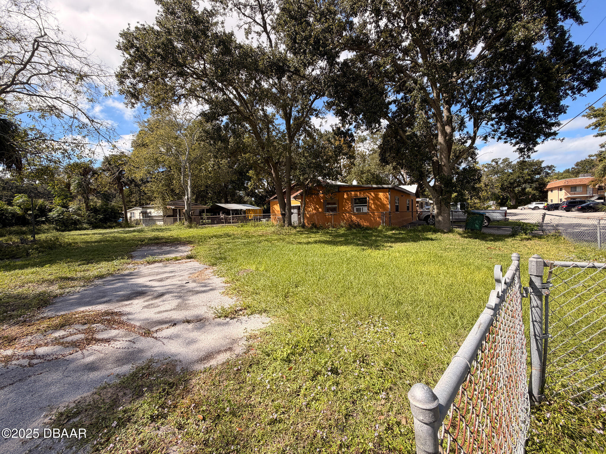 548 3rd Street Holly Hill, FL 32117 - Photo 6 of 9 a view of a yard with swimming pool