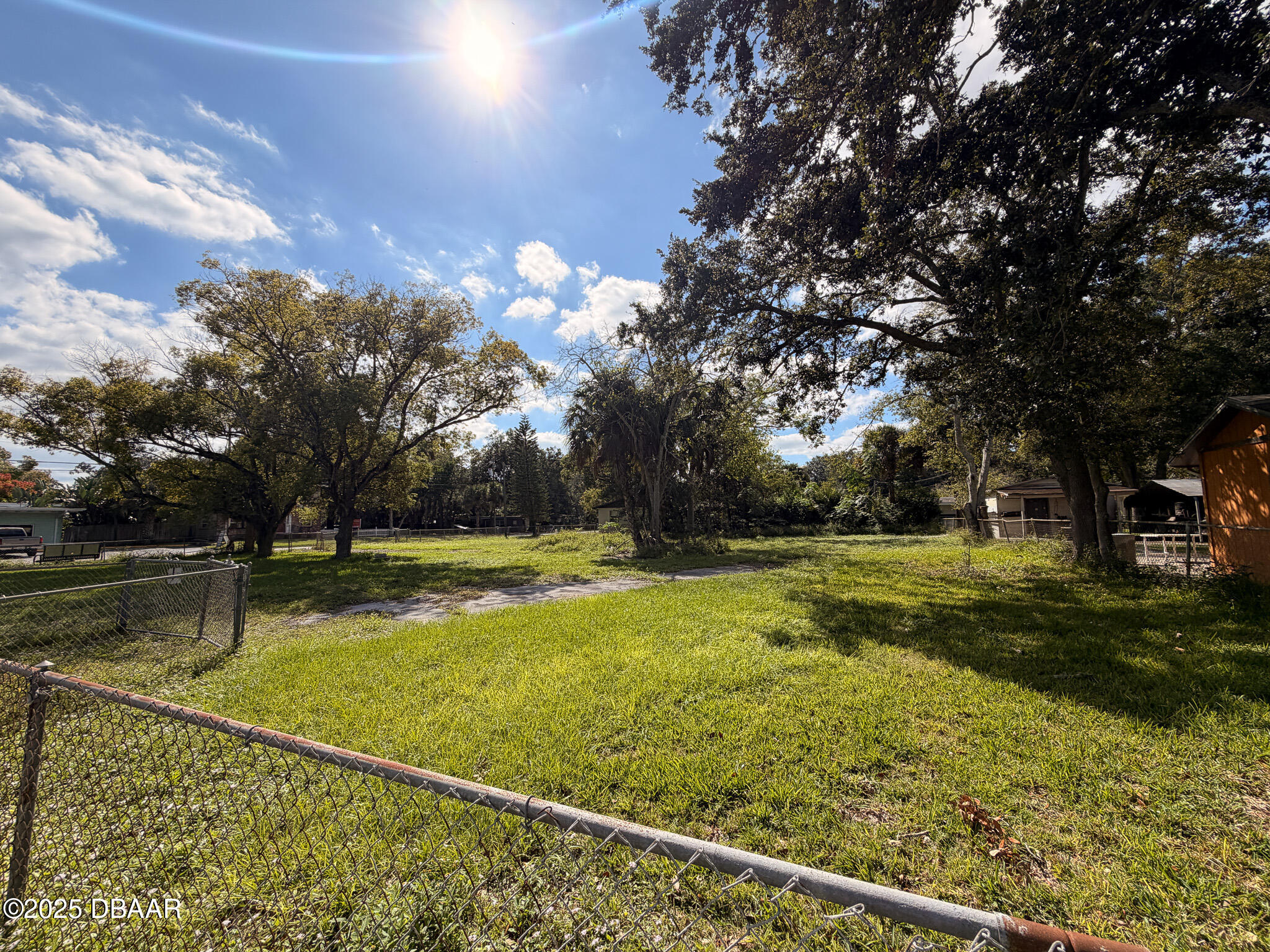 548 3rd Street Holly Hill, FL 32117 - Photo 7 of 9 a view of yard with swimming pool and green space