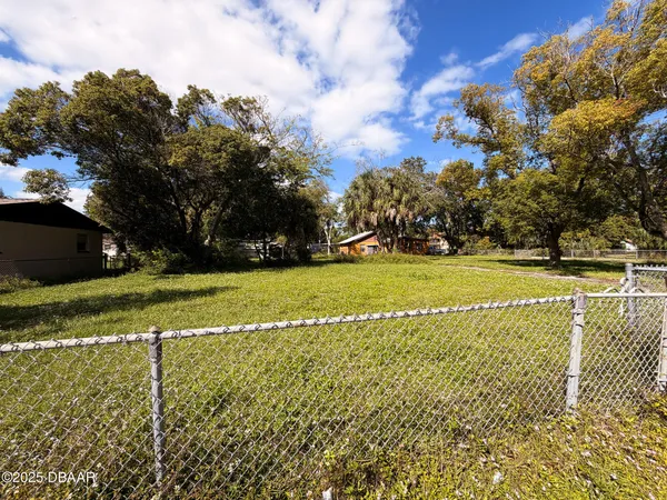 a view of a golf course with a lake