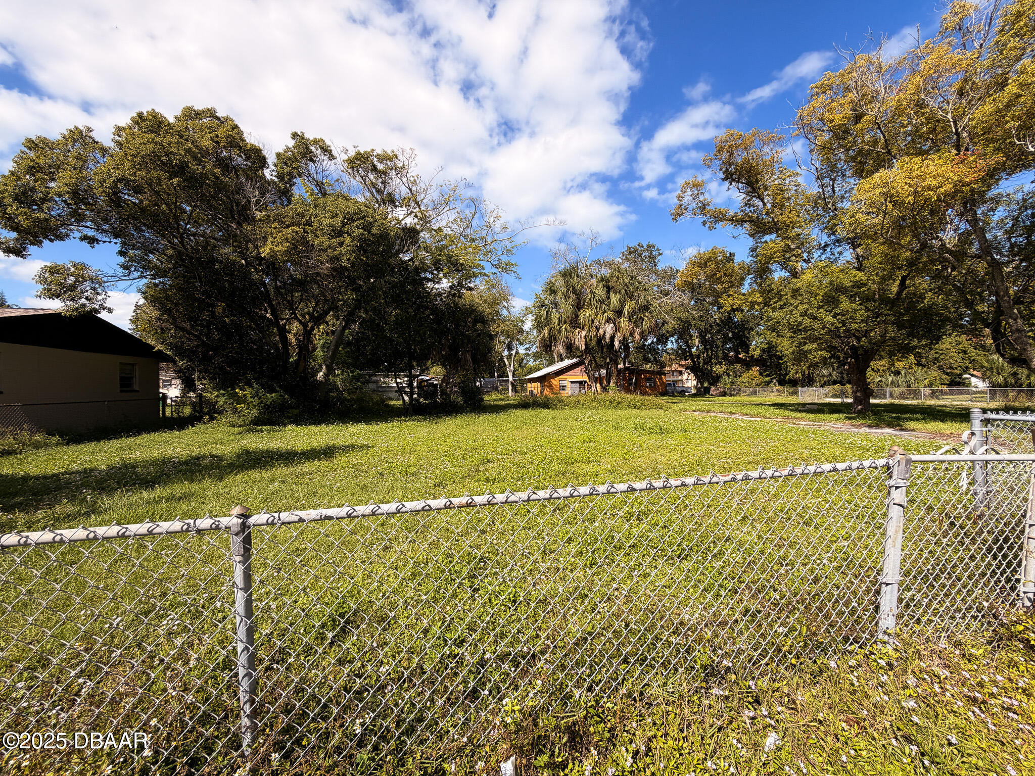 548 3rd Street Holly Hill, FL 32117 - Photo 8 of 9 a view of a golf course with a lake