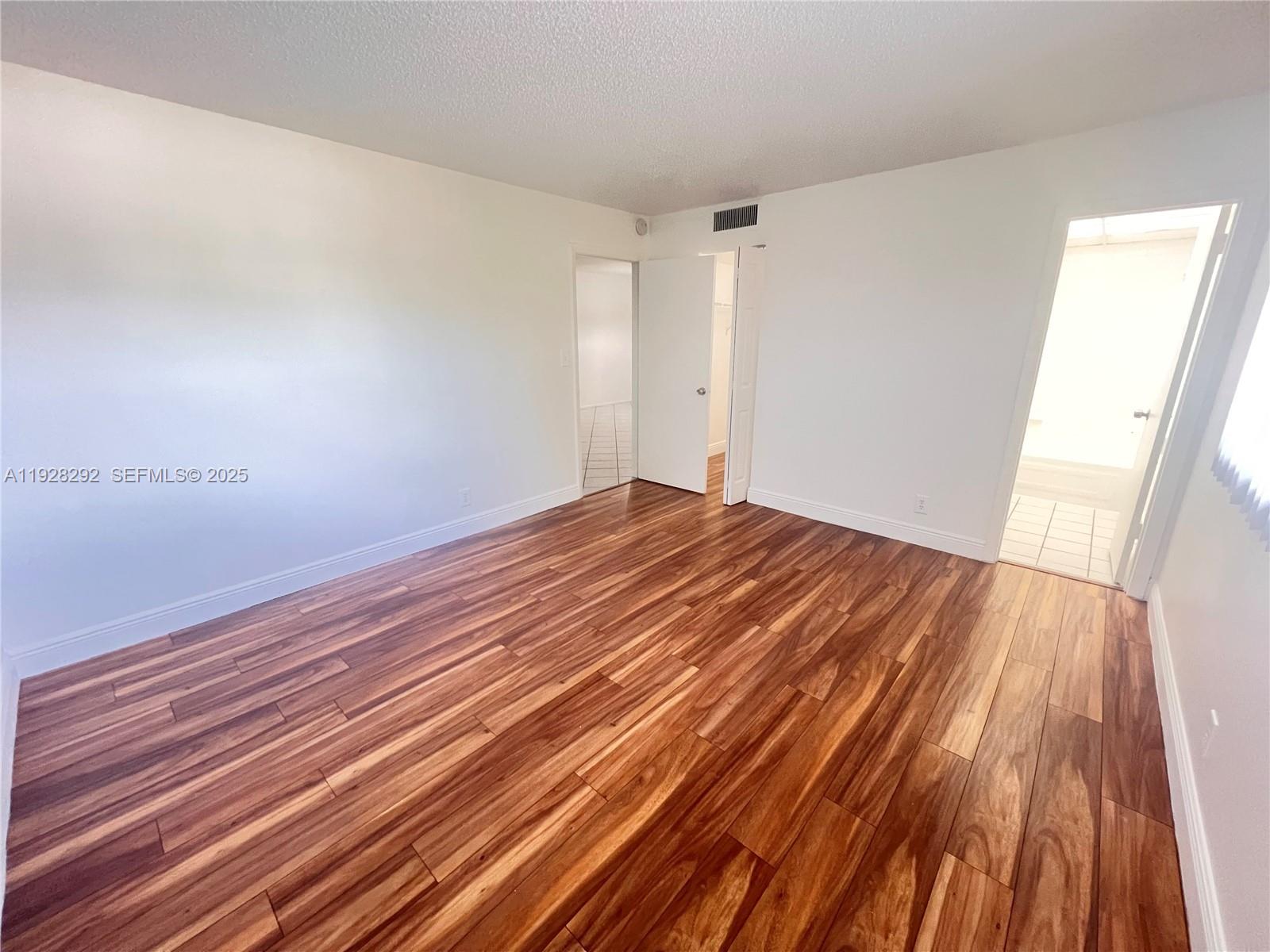 7820 South Colony Circle, Unit 301 Tamarac, FL 33321 - Photo 6 of 13 a view of room with wooden floor