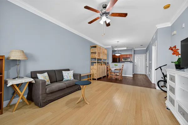 a view of a dining room with furniture and wooden floor