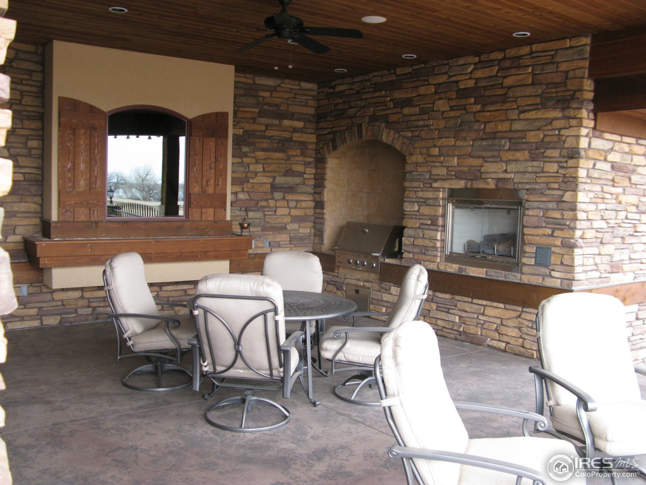 6343 Rookery Road Fort Collins, CO 80528 - Photo 8 of 24 a dining room with furniture and a fireplace