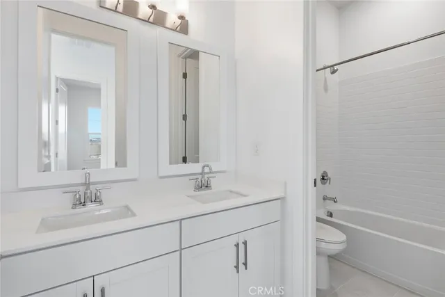 a bathroom with a sink toilet a tub and shower