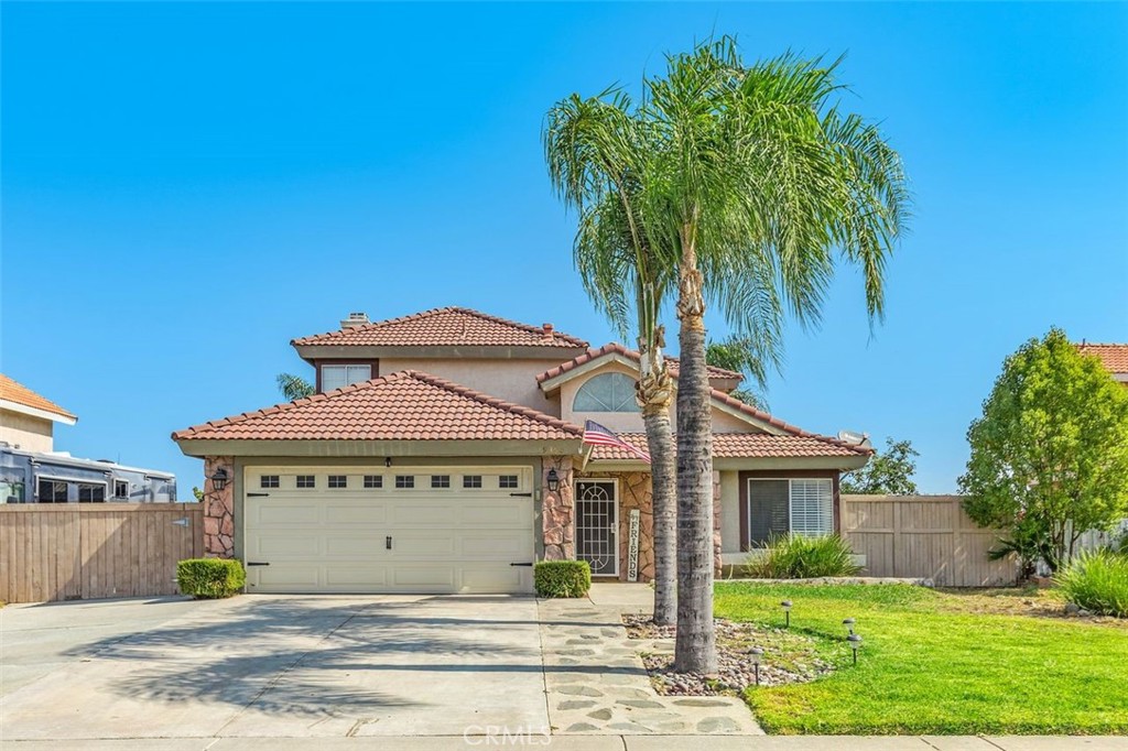 19350 Totem Court Riverside, CA 92508 - Photo 1 of 1 a front view of a house with a garden