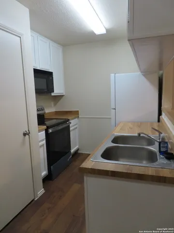 a kitchen with a stove and a microwave