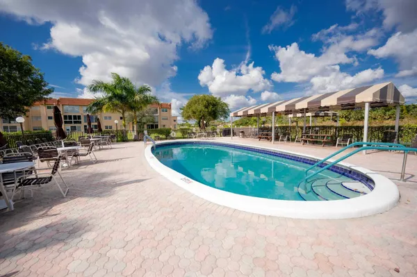 a view of a swimming pool with a patio
