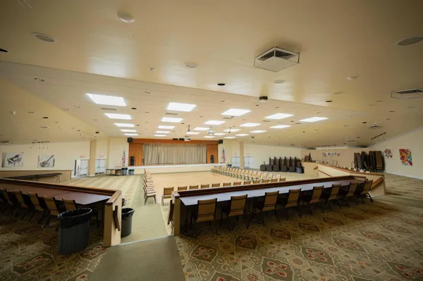 a large swimming pool with a outdoor seating