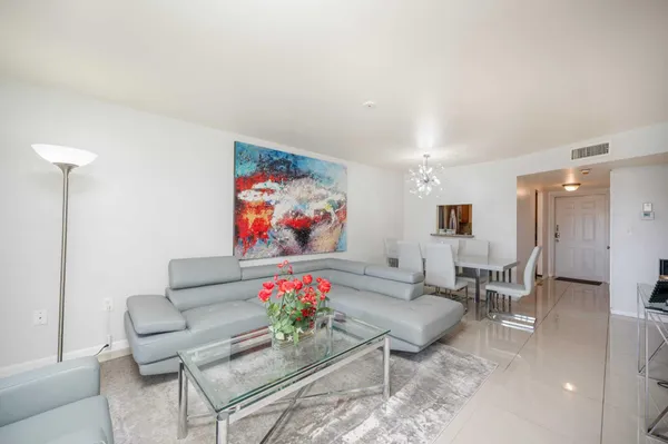 a living room with furniture and a rug