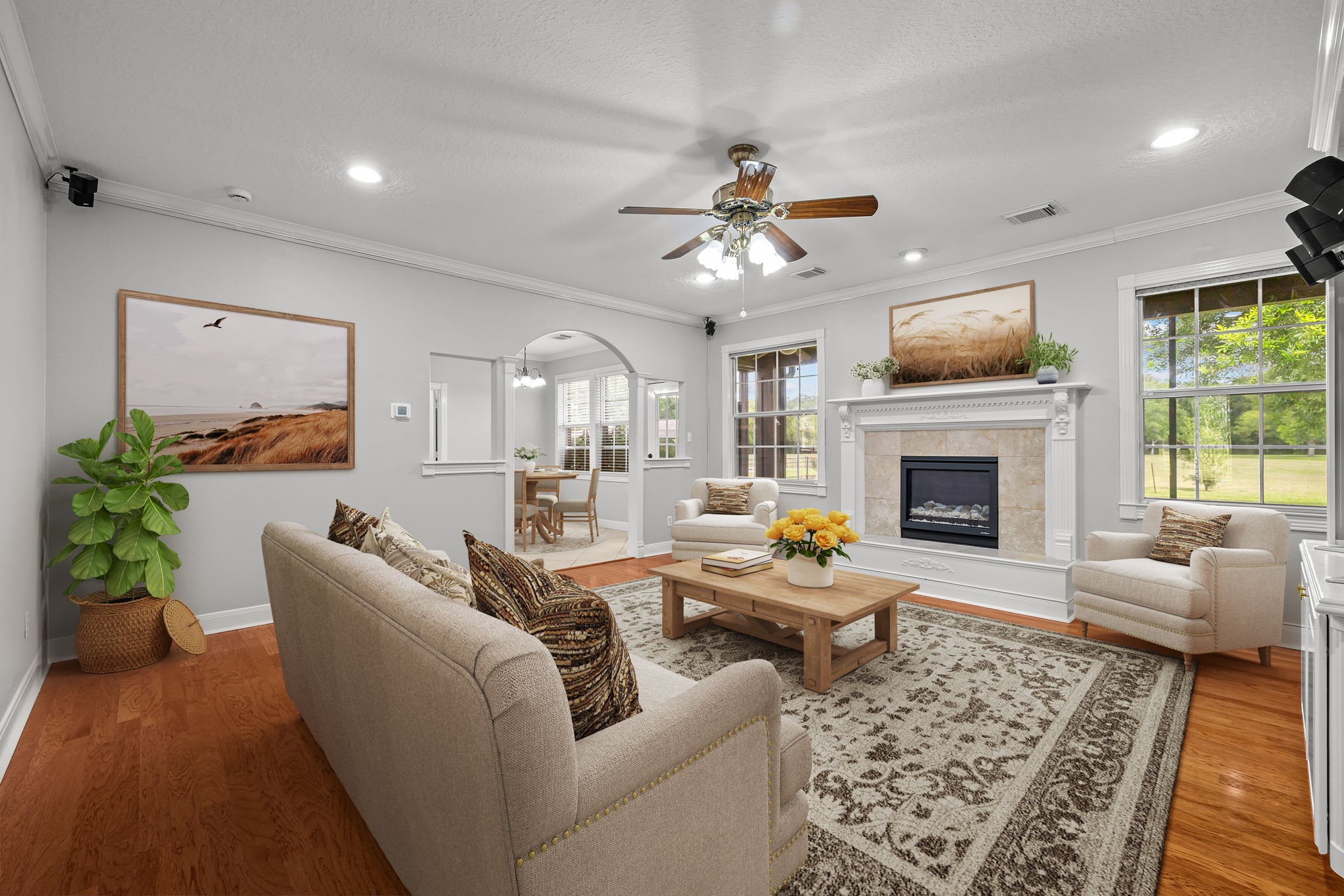 6410 Old Chocolate Bayou Road Manvel, TX 77578 - Photo 12 of 49 Living room features a charming
fireplace, perfect for relaxation
and gatherings. *Virtually Staged