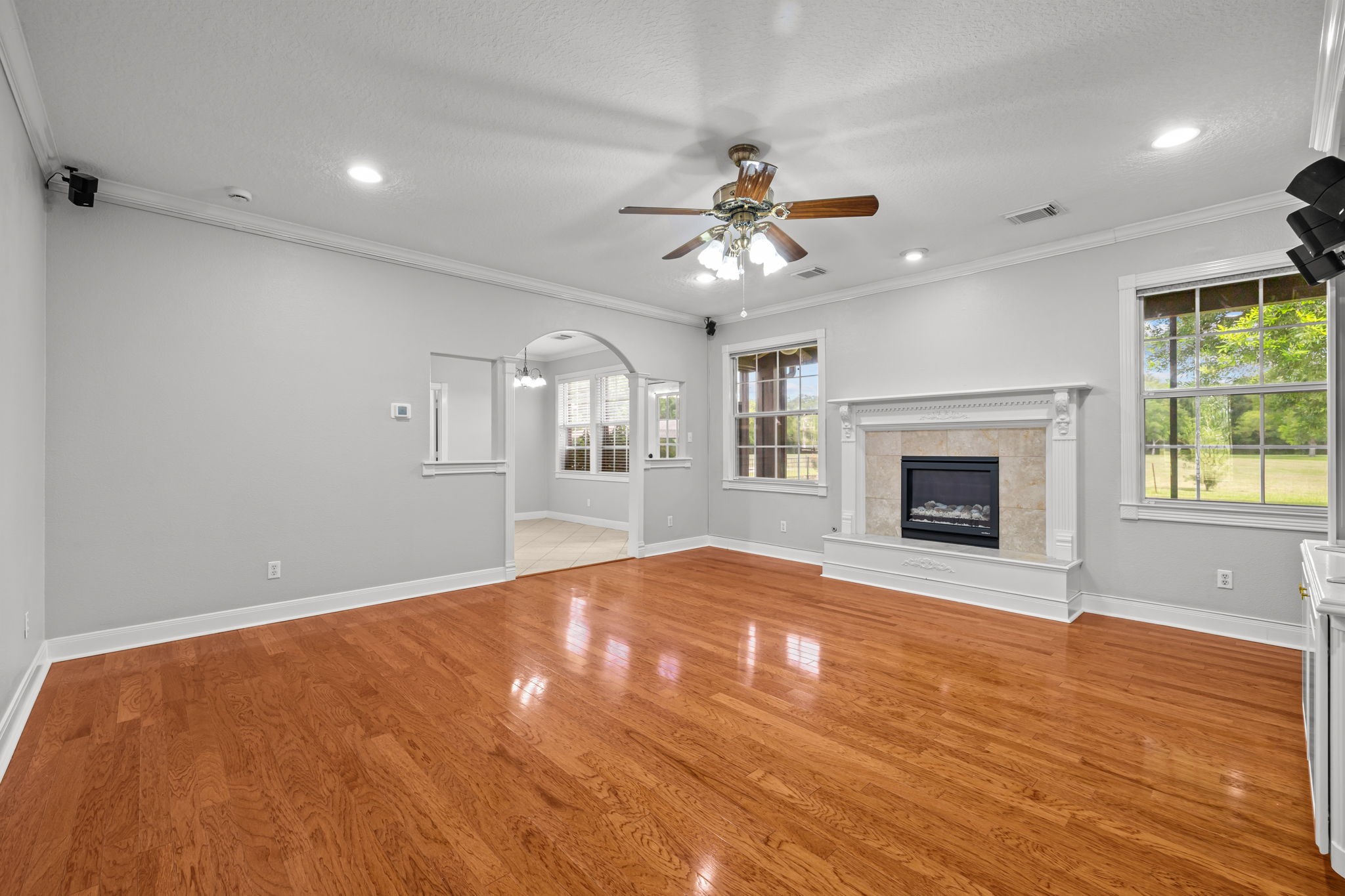 6410 Old Chocolate Bayou Road Manvel, TX 77578 - Photo 13 of 49 Living room features a charming
fireplace, perfect for relaxation
and gatherings.