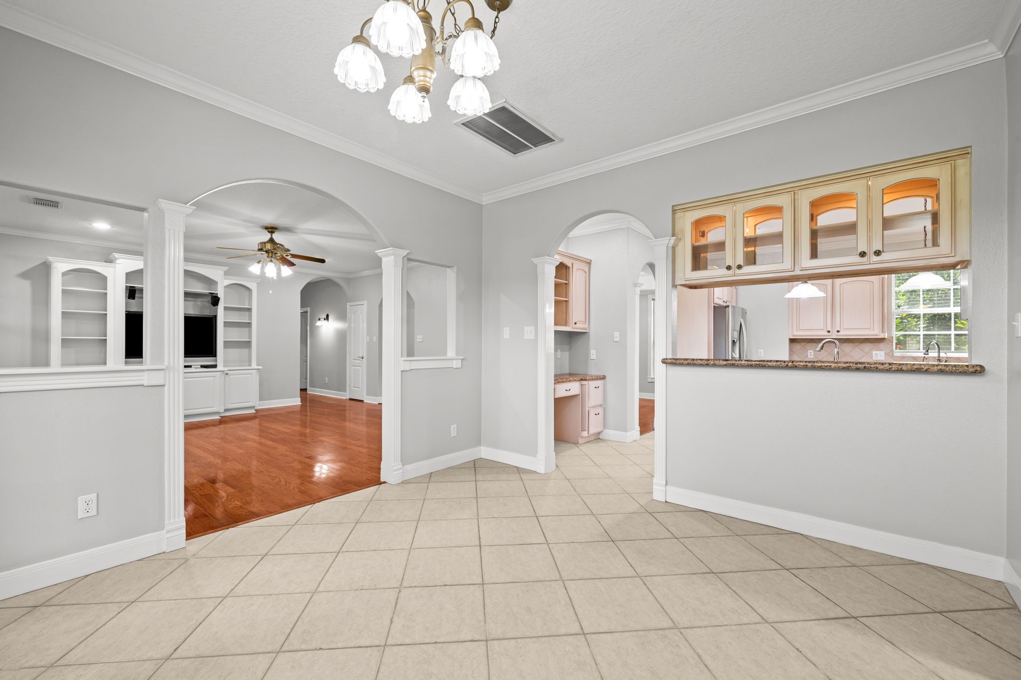 6410 Old Chocolate Bayou Road Manvel, TX 77578 - Photo 15 of 49 Effortless flow and clear views into the living room and kitchen ideal for both casual meals and entertaining.