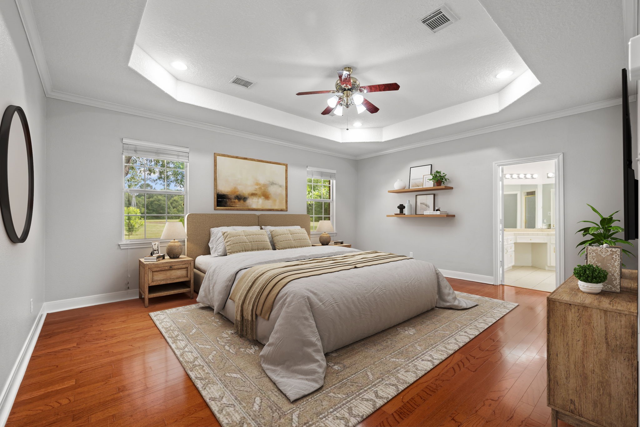 6410 Old Chocolate Bayou Road Manvel, TX 77578 - Photo 17 of 49 Spacious primary suite featuring rich wood flooring, a tray ceiling with recessed lighting, and direct access to a private ensuite bathroom. *Virtually Staged