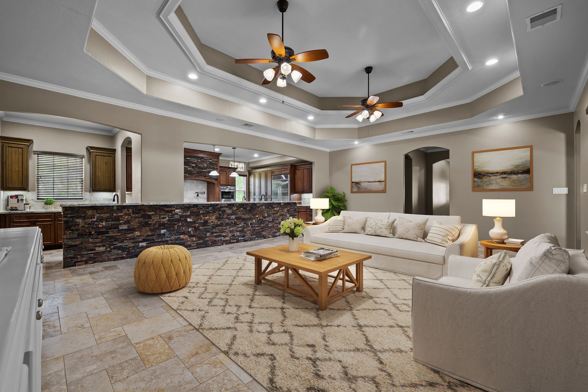 6410 Old Chocolate Bayou Road Manvel, TX 77578 - Photo 31 of 49 Experience the elegance of this
expansive living space, opening
to a covered patio with
breathtaking pool views.
Featuring premium limestone
flooring, imported for its
unmatched durability and beauty. *Virtually Staged