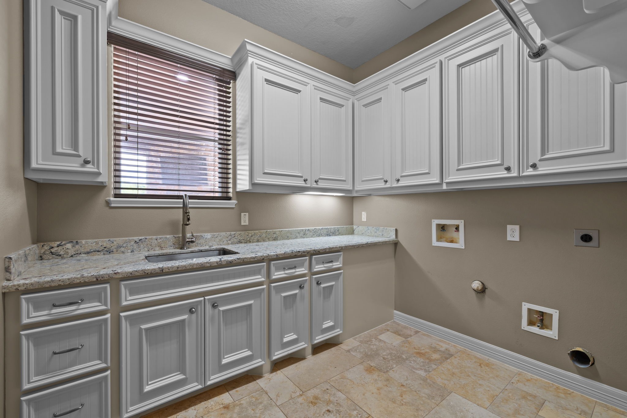 6410 Old Chocolate Bayou Road Manvel, TX 77578 - Photo 34 of 49 Spacious laundry room with
ample storage and a convenient
sink.