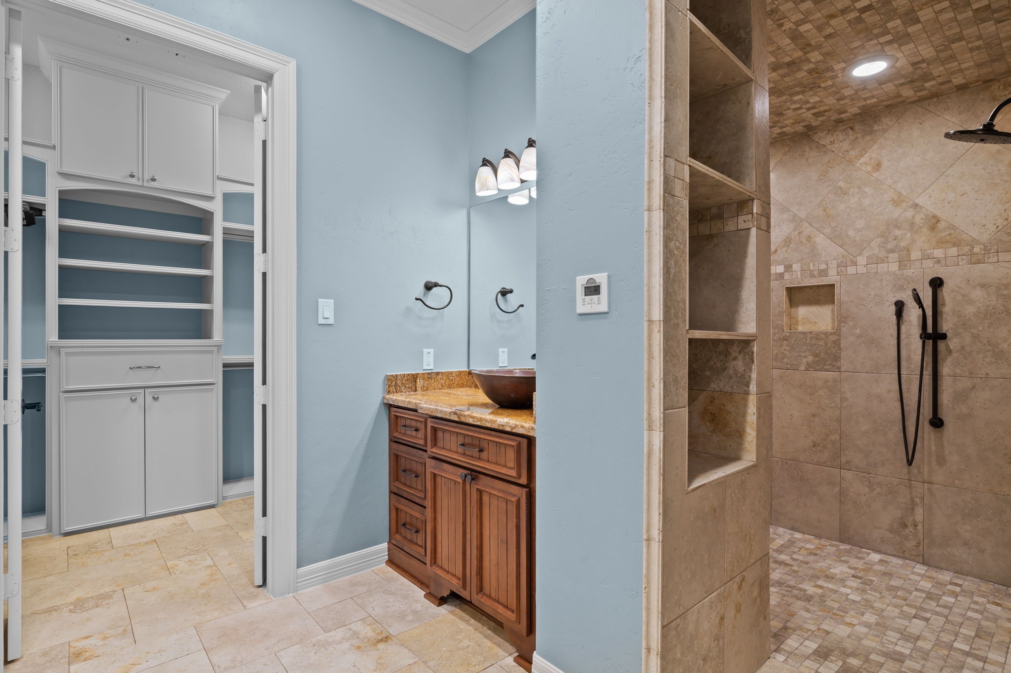 6410 Old Chocolate Bayou Road Manvel, TX 77578 - Photo 37 of 49 Experience luxury in this primary
bathroom featuring a spacious
walk-in shower.