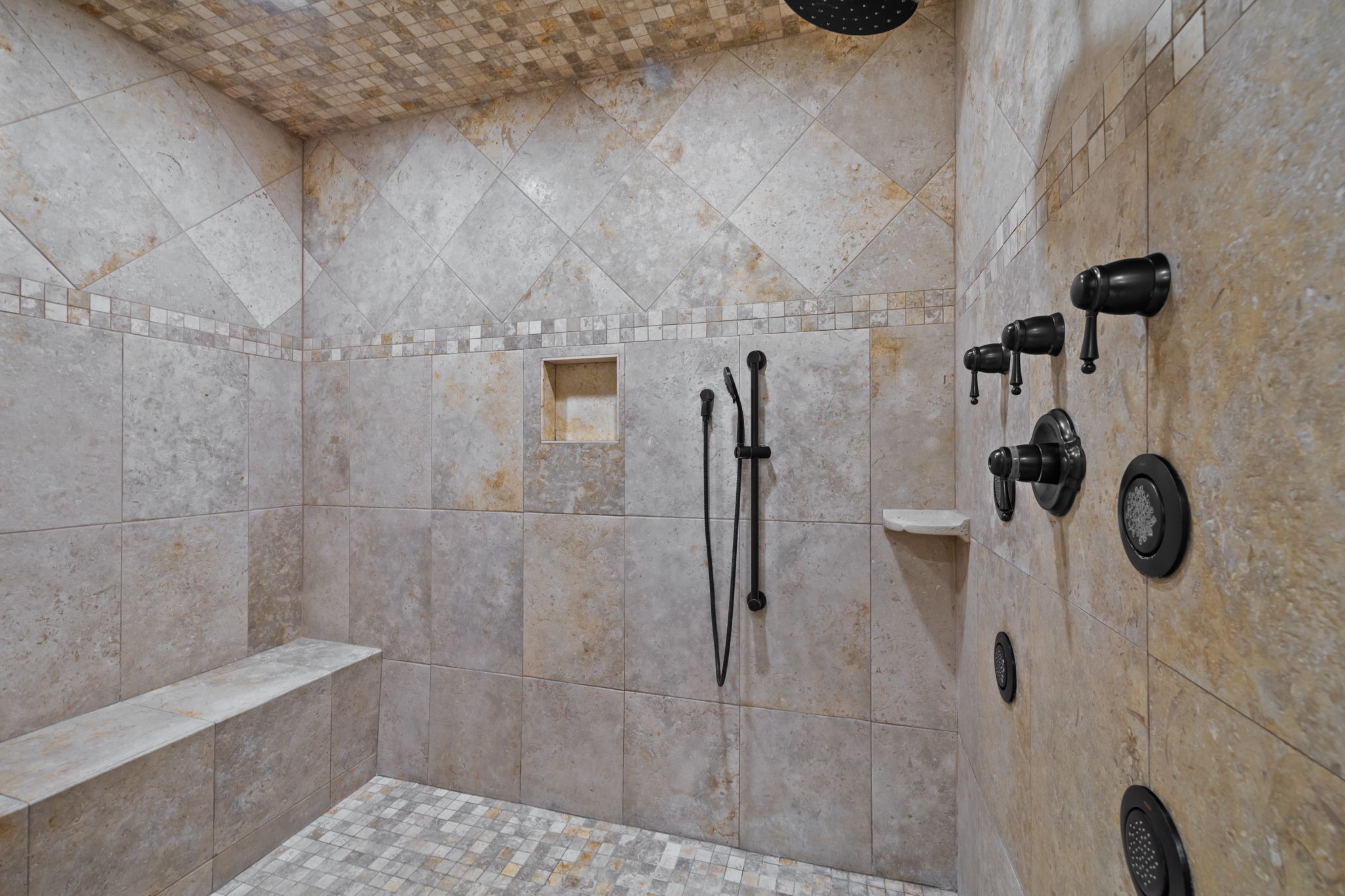 6410 Old Chocolate Bayou Road Manvel, TX 77578 - Photo 38 of 49 Expansive walk-in shower featuring a built-in bench, rainfall shower head, and custom tile surround.