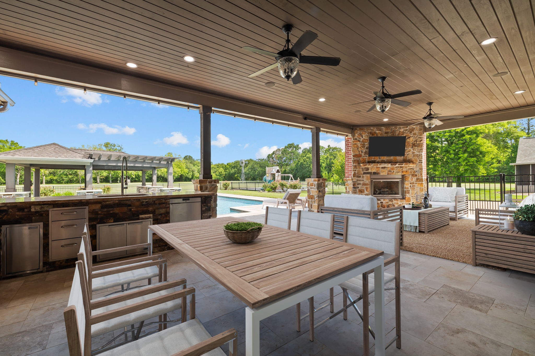 6410 Old Chocolate Bayou Road Manvel, TX 77578 - Photo 4 of 49 Cozy up by the elegant outdoor
fireplace, perfect for entertaining
or relaxing under the stars. *Virtually Staged