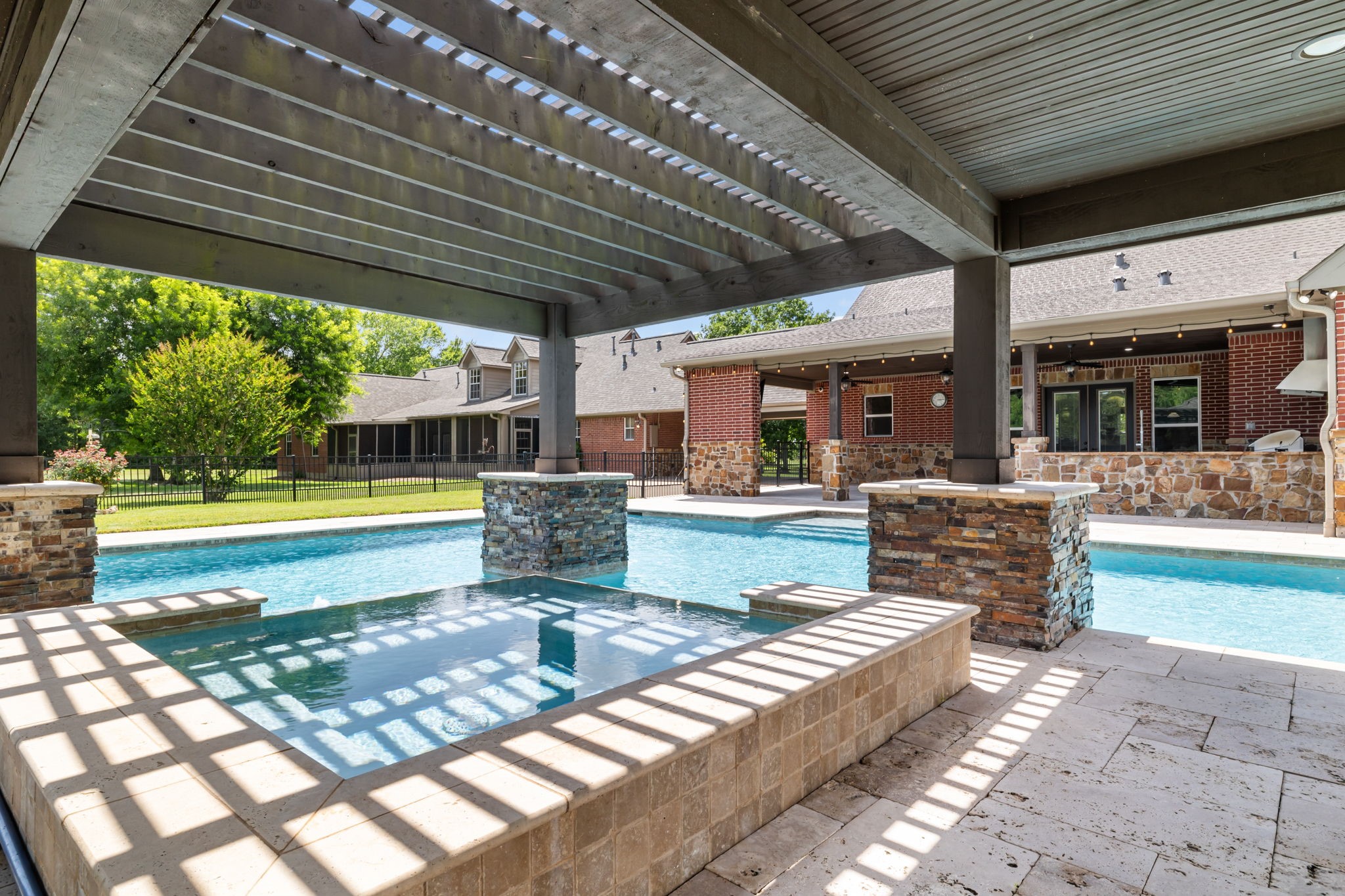 6410 Old Chocolate Bayou Road Manvel, TX 77578 - Photo 46 of 49 Unwind in this elegant covered
spa, seamlessly blending into
your outdoor oasis, complete
with a built-in sound system for
ultimate relaxation.
