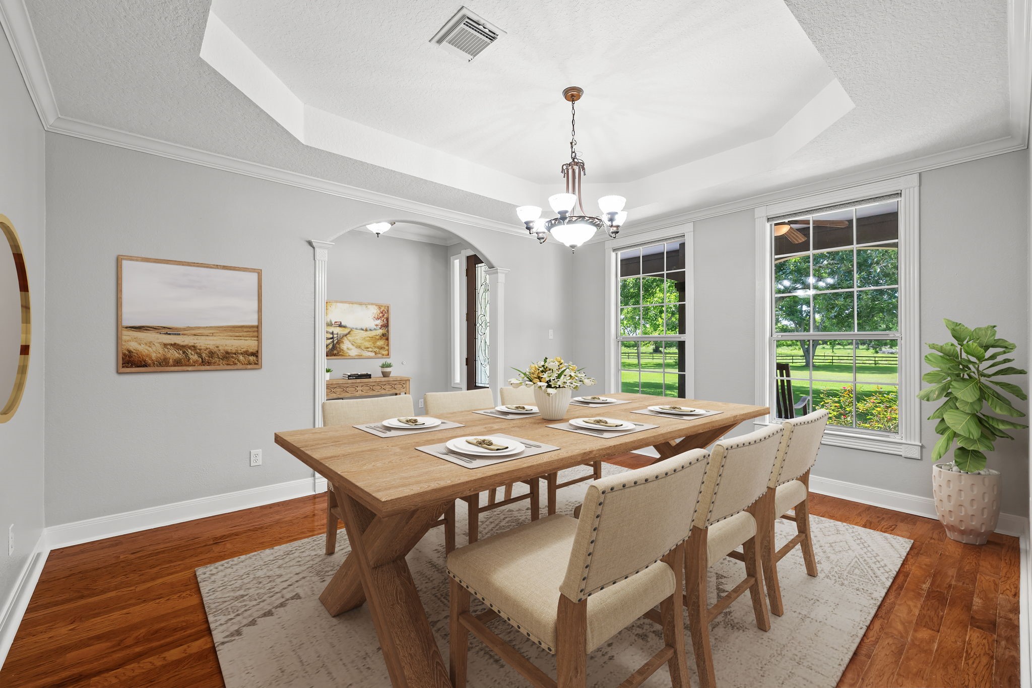 6410 Old Chocolate Bayou Road Manvel, TX 77578 - Photo 8 of 49 Elegant dining room with
hardwood floors, abundant
natural light, and a stylish
chandelier, perfect for hosting
gatherings. *Virtually Staged