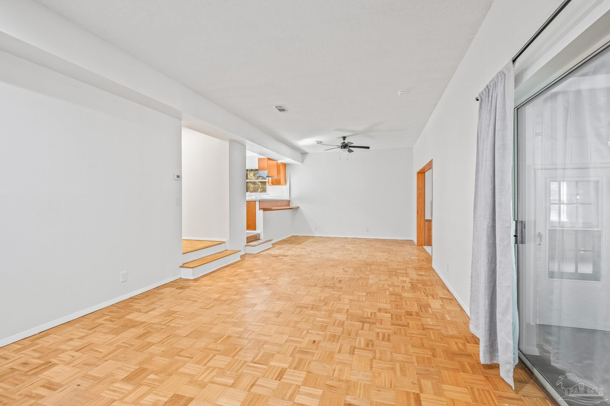 4928 Shell Road Milton, FL 32583 - Photo 29 of 60 a view of empty room with wooden floor and fan