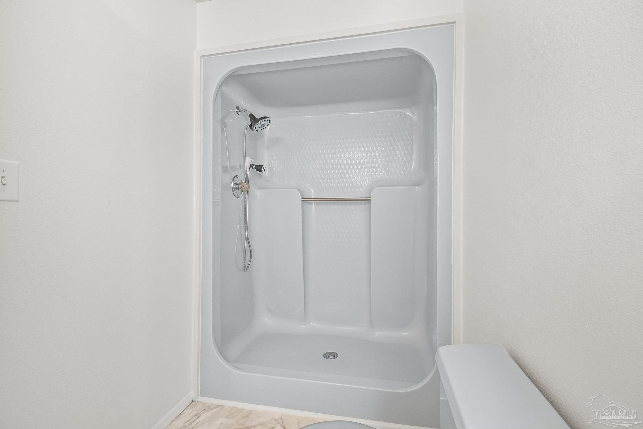 4928 Shell Road Milton, FL 32583 - Photo 46 of 60 a bathroom with a glass shower door